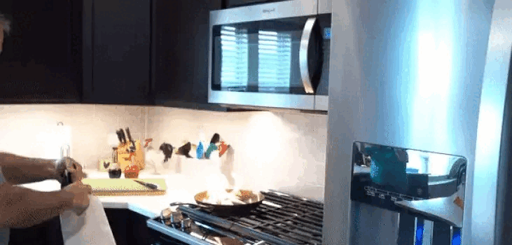 gif of man turning off fire in kitchen with Prepared Hero Fire Blanket